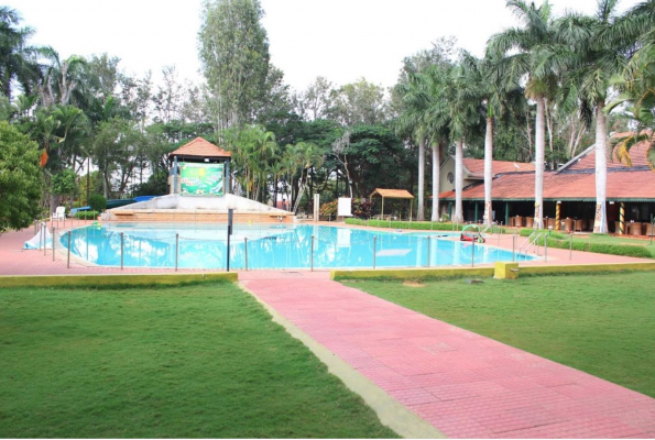 Pool Lawn And Restro Of Chairmans Jade, Chairman S Jade Club Resort