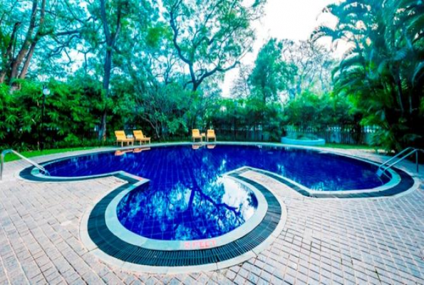 Pool and Lawn at Hotel Royal Orchid Metropole