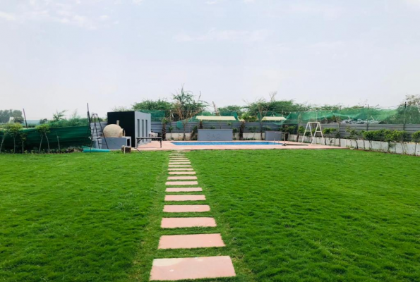 Pool With Lawn at Tosh Resort And Farm House