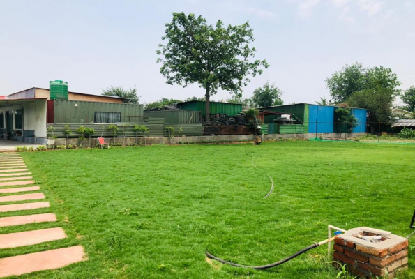 Pool With Lawn at Tosh Resort And Farm House