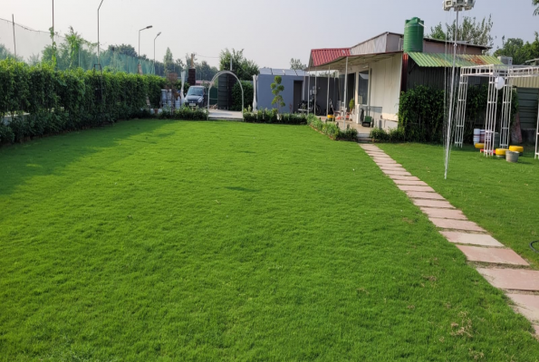 Pool With Lawn at Tosh Resort And Farm House