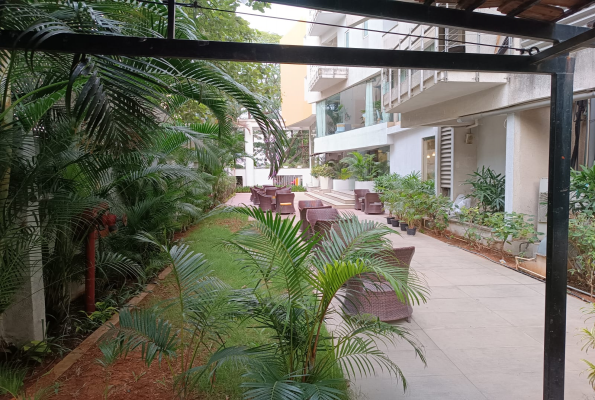 Boarding Pass Restaurant And Poolside Lawn at Bloom Suites Hotel
